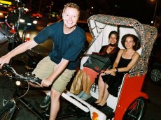 Photo: Passengers in a pedicab advertising Kate Spade.
